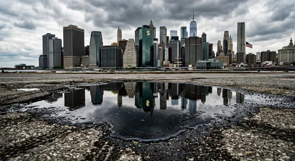 Financial district skyline reflected in a puddle of crude oil