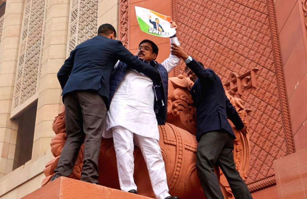 MPs of INDIA bloc climb the walls of Makar Dwar at the Parliament and ...